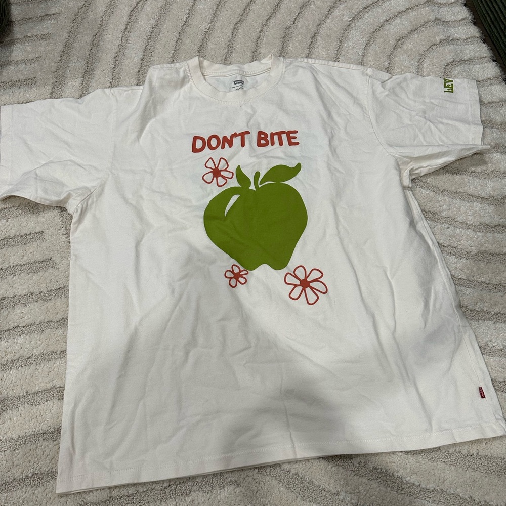 White Shirt with Green Apple Design